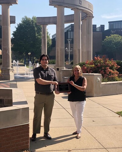 Sherrie Elzinga and GPSI Student in front of the UIS Colonnade