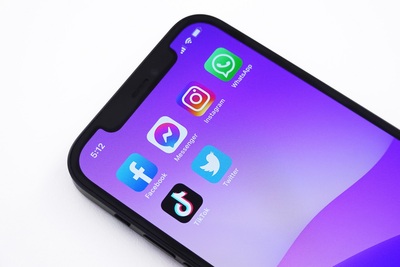 Photo of iphone with Social Media icons