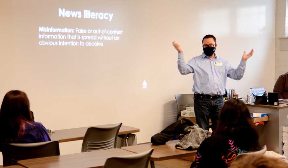 Jason Piscia, PAR Director, teaching news literacy in a high school class room