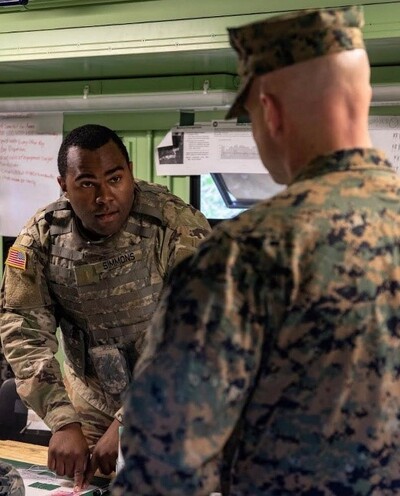 Photo of DeJoie Simmons at work in miliary uniform