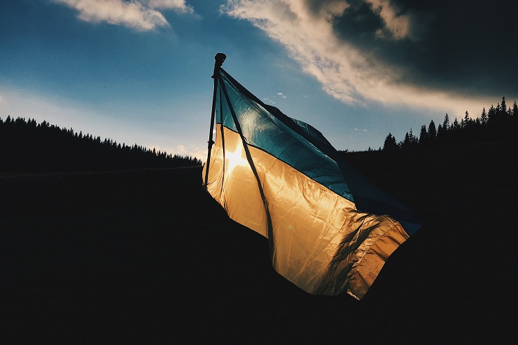 Photo of Ukrainian flag backlit by the sun