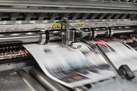 Photo of a newspaper being printed