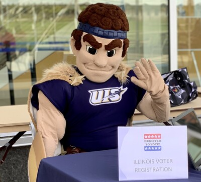 Image of UIS mascot, Orion, assisting with Illinois Voter Registration at the UIS Student Union